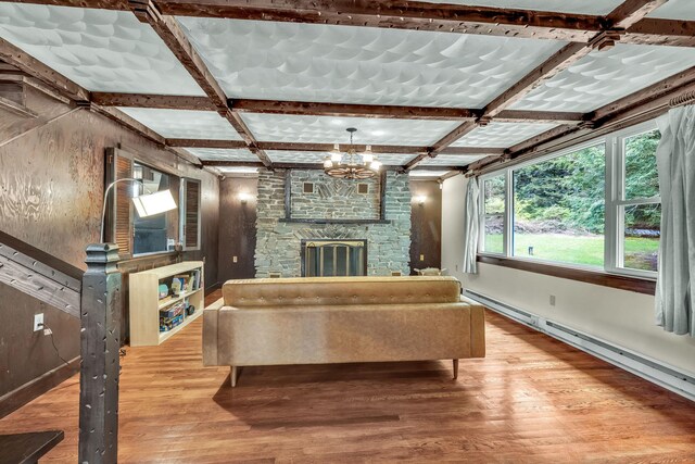 85 Woodard Rd, Parksville, NY 12768 - living area featuring wood finished floors, baseboards, a chandelier, a baseboard heating unit, and coffered ceiling