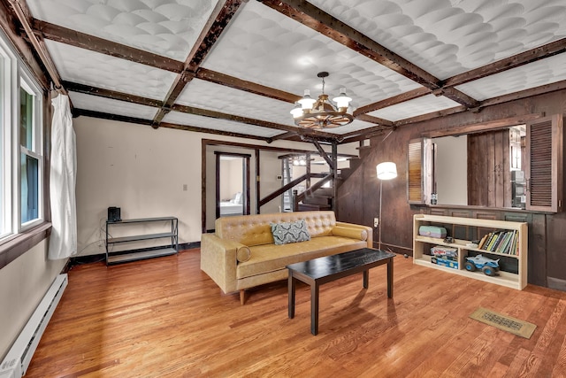 85 Woodard Rd, Parksville, NY 12768 - living area with baseboard heating, coffered ceiling, wood finished floors, a chandelier, and baseboards