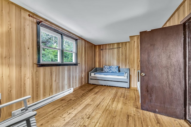 85 Woodard Rd, Parksville, NY 12768 - living area with a baseboard radiator, hardwood / wood-style flooring, and wood walls