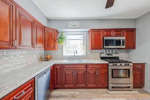 7 Hedge Ln, Centereach, NY 11720 - kitchen with stainless steel appliances, decorative backsplash, a sink, and dark brown cabinets