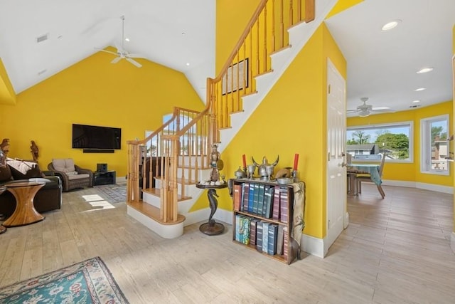 10 Delta Rd, Massapequa, NY 11758 - staircase featuring a ceiling fan, baseboards, wood finished floors, vaulted ceiling, and recessed lighting