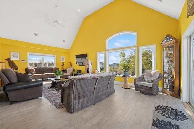 10 Delta Rd, Massapequa, NY 11758 - living room with high vaulted ceiling, light wood finished floors, plenty of natural light, and a ceiling fan