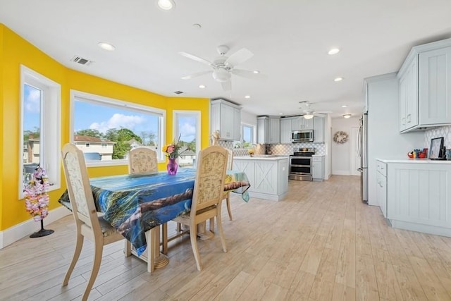 10 Delta Rd, Massapequa, NY 11758 - dining room with ceiling fan, light wood-style flooring, plenty of natural light, and recessed lighting