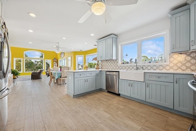 10 Delta Rd, Massapequa, NY 11758 - kitchen with gray cabinets, stainless steel appliances, a ceiling fan, plenty of natural light, and recessed lighting