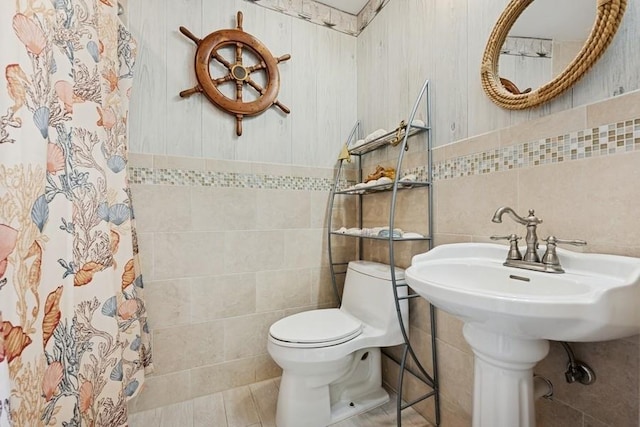 10 Delta Rd, Massapequa, NY 11758 - bathroom with tile walls, toilet, and a shower with curtain