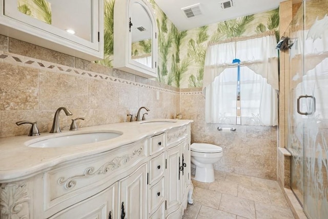 10 Delta Rd, Massapequa, NY 11758 - bathroom featuring plenty of natural light, wallpapered walls, toilet, a shower stall, and double vanity