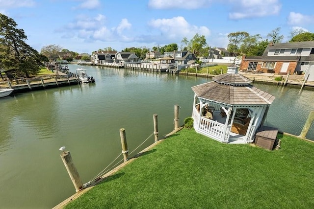 10 Delta Rd, Massapequa, NY 11758 - dock area featuring a gazebo, a water view, a residential view, and a lawn