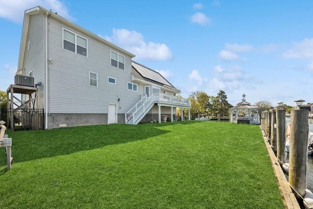 10 Delta Rd, Massapequa, NY 11758 - rear view of house with a gazebo, stairs, and a wooden deck