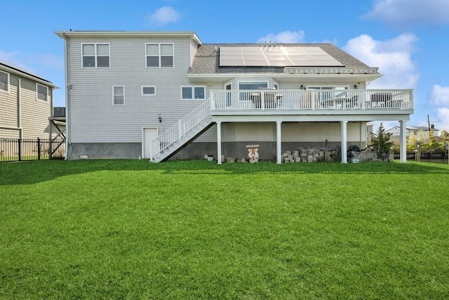 10 Delta Rd, Massapequa, NY 11758 - rear view of house featuring stairs, a deck, and solar panels