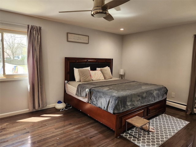 bedroom featuring baseboard heating, a ceiling fan, dark wood finished floors, baseboards, and recessed lighting