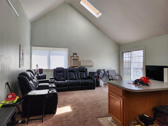 living room with a skylight, carpet floors, an AC wall unit, and high vaulted ceiling