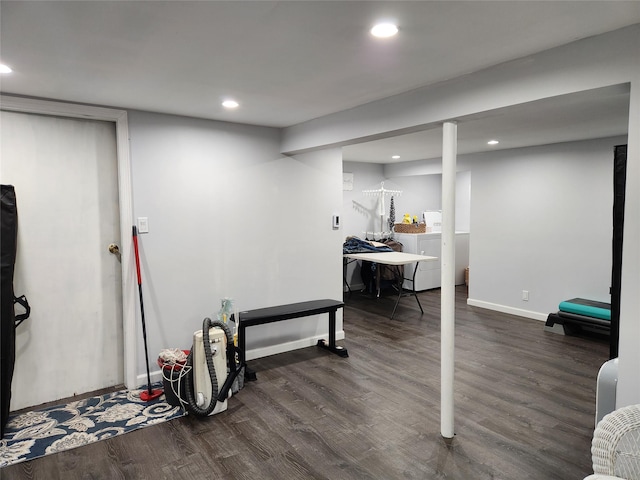 finished basement featuring washer and clothes dryer, dark wood-style floors, and recessed lighting