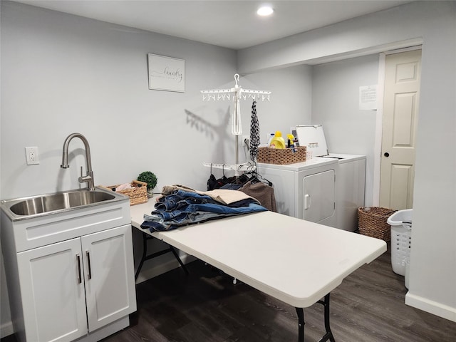 laundry area with a sink, dark wood finished floors, baseboards, recessed lighting, and washer and dryer