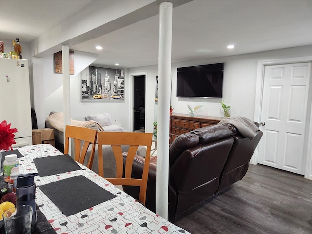 dining space with dark wood finished floors and recessed lighting