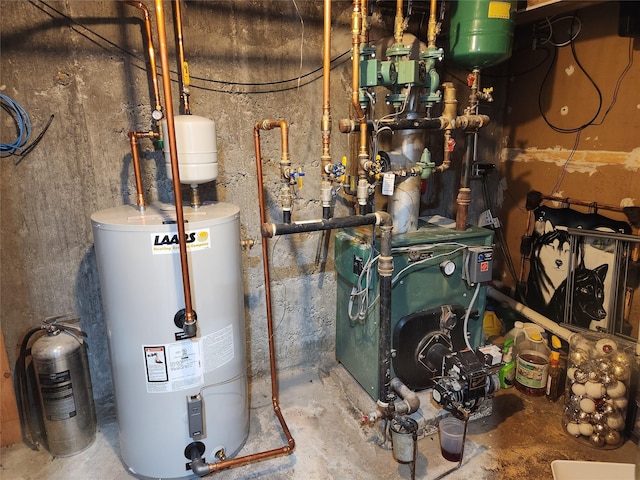 utility room featuring water heater and a heating unit
