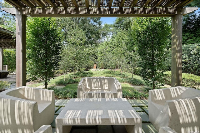 view of patio / terrace with a pergola and outdoor dining area