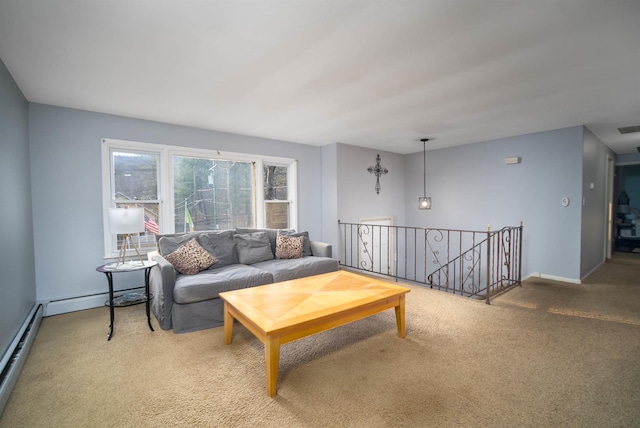 living room featuring a baseboard radiator, visible vents, a baseboard heating unit, baseboards, and carpet