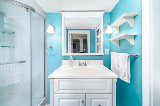 bathroom with a stall shower and vanity