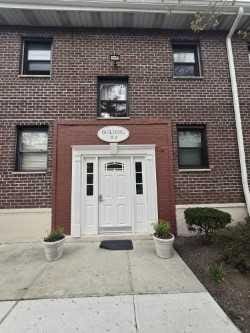5 Adelaide St Unit B2D1, Floral Park, NY 11001 - doorway to property featuring brick siding
