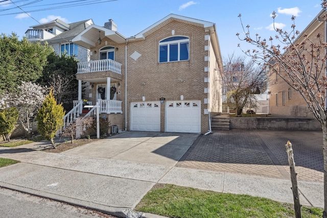 154-60 Riverside Dr, Whitestone, NY 11357 - traditional home featuring brick siding, driveway, a balcony, and a garage