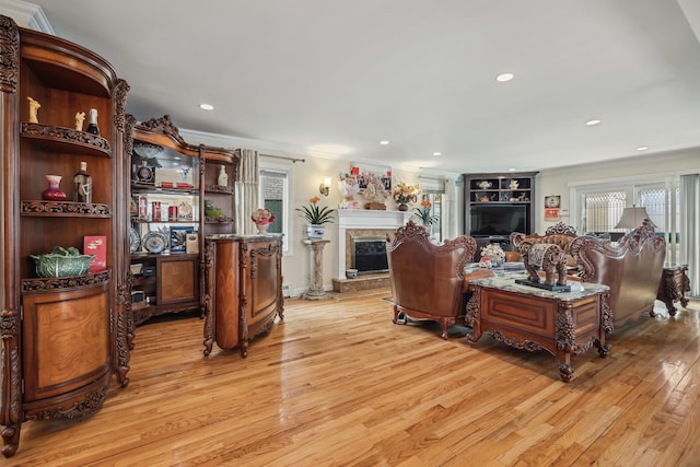 154-60 Riverside Dr, Whitestone, NY 11357 - living room featuring light wood-type flooring, a fireplace with raised hearth, and ornamental molding
