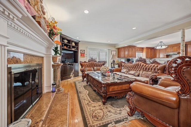 154-60 Riverside Dr, Whitestone, NY 11357 - living area featuring recessed lighting, light wood-style floors, crown molding, and a premium fireplace