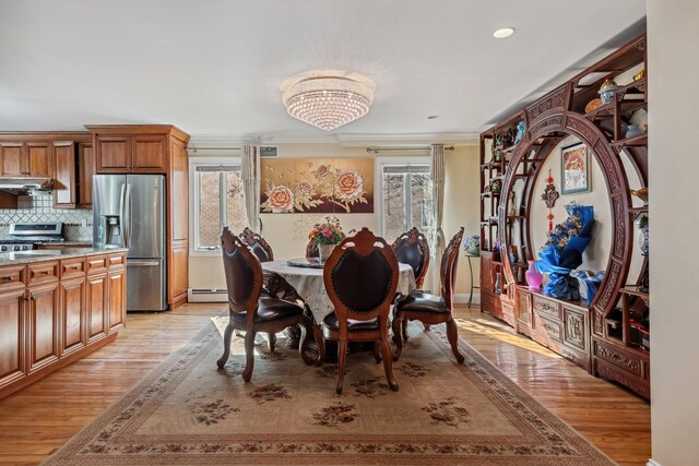 154-60 Riverside Dr, Whitestone, NY 11357 - dining area featuring plenty of natural light, light wood-style flooring, and a baseboard radiator