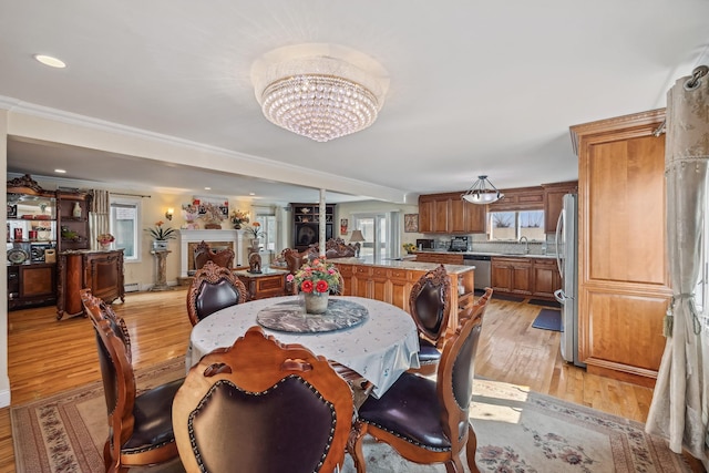 154-60 Riverside Dr, Whitestone, NY 11357 - dining area with ornamental molding, a notable chandelier, light wood finished floors, and recessed lighting
