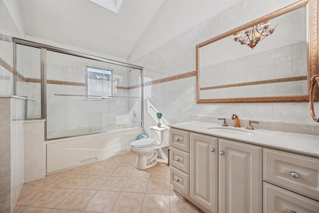 154-60 Riverside Dr, Whitestone, NY 11357 - full bath with tile patterned floors, toilet, tile walls, vaulted ceiling, and vanity