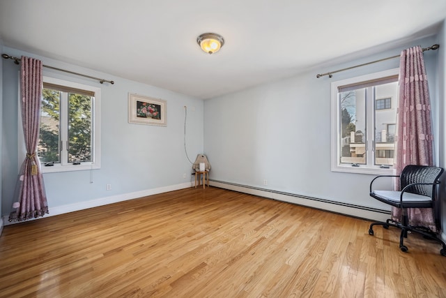 154-60 Riverside Dr, Whitestone, NY 11357 - unfurnished room featuring light wood-style floors, baseboards, and baseboard heating
