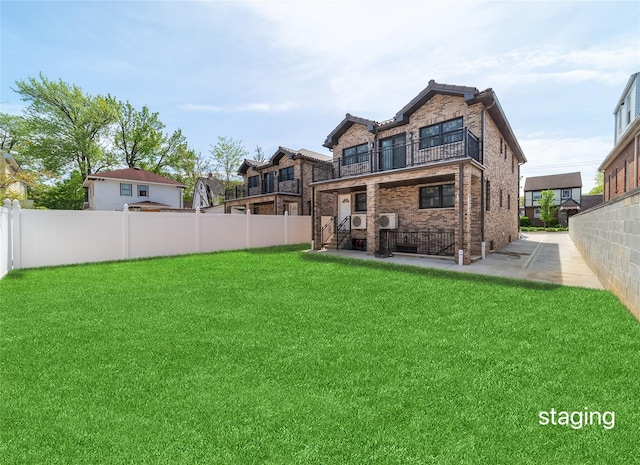 3405 Corporal Kennedy St, Bayside, NY 11361 - rear view of house with a yard, a balcony, a fenced backyard, and a patio area