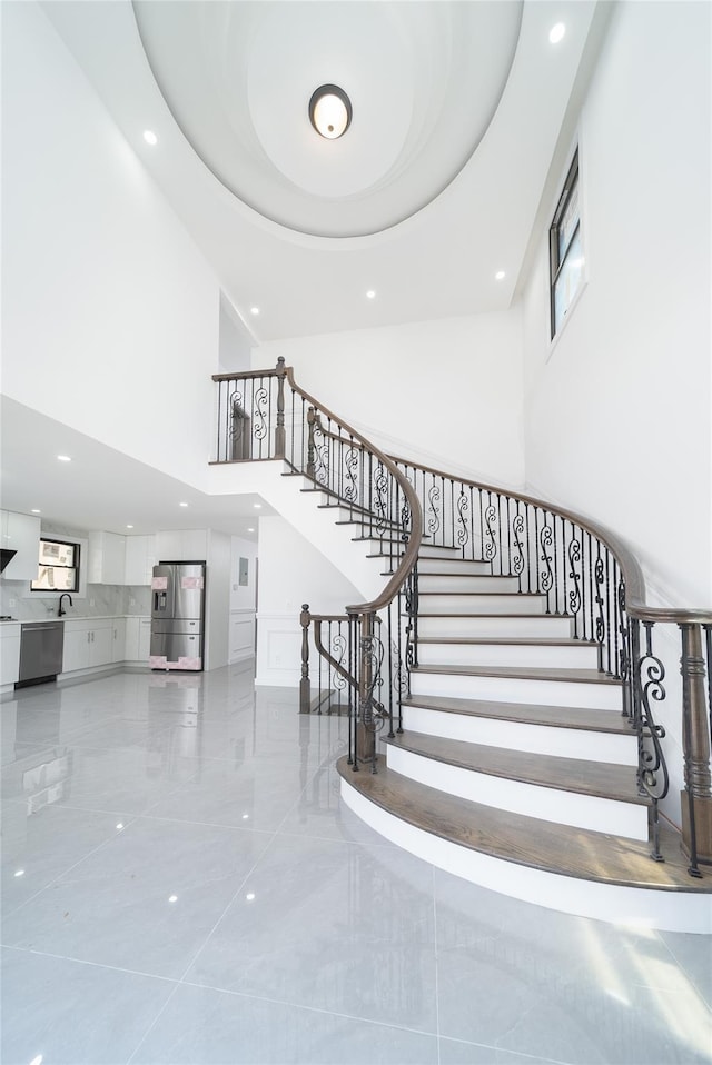 3405 Corporal Kennedy St, Bayside, NY 11361 - stairs with recessed lighting and a high ceiling