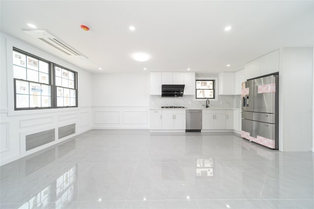 3405 Corporal Kennedy St, Bayside, NY 11361 - unfurnished living room with a sink, wainscoting, a decorative wall, and recessed lighting