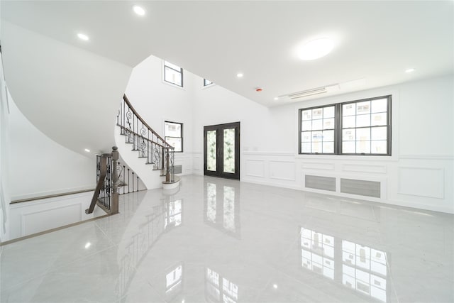 3405 Corporal Kennedy St, Bayside, NY 11361 - foyer with french doors, stairs, a wainscoted wall, a decorative wall, and recessed lighting