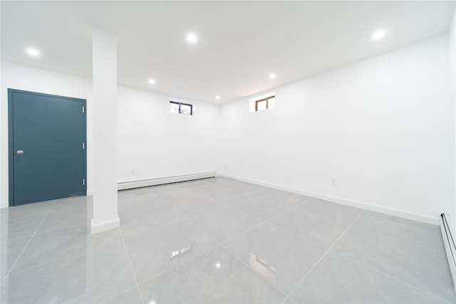 3405 Corporal Kennedy St, Bayside, NY 11361 - below grade area with light tile patterned floors, a baseboard heating unit, and recessed lighting