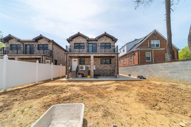 3405 Corporal Kennedy St, Bayside, NY 11361 - rear view of house with brick siding, a patio, a balcony, and a fenced backyard