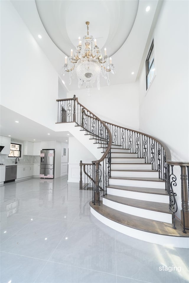 3405 Corporal Kennedy St, Bayside, NY 11361 - stairway featuring recessed lighting, a high ceiling, and a chandelier