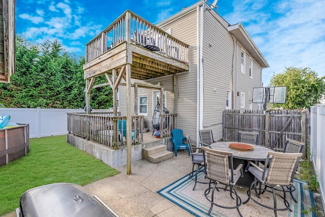 rear view of property featuring a fenced backyard, a patio area, a lawn, a deck, and outdoor dining space