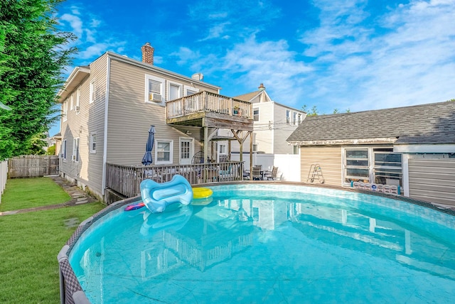 view of swimming pool with a lawn, a fenced backyard, and a fenced in pool