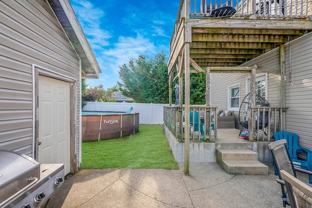 view of yard featuring a fenced backyard, a fenced in pool, and a patio