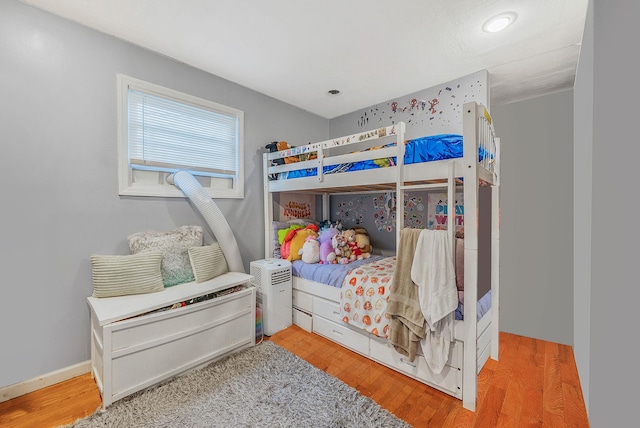 bedroom featuring wood finished floors