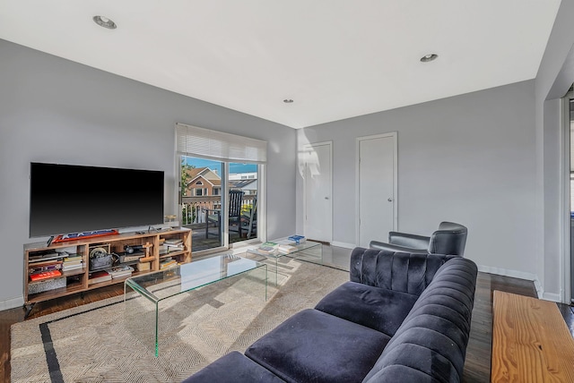 living room with recessed lighting, wood finished floors, and baseboards