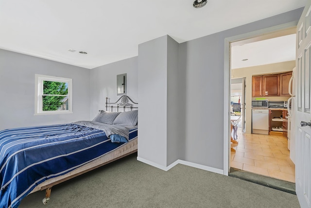 bedroom with electric panel, baseboards, and light carpet