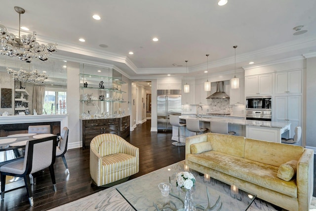 living area with ornamental molding, dark wood finished floors, baseboards, and recessed lighting