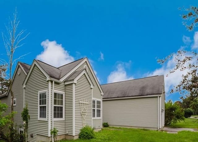 7 Cornwell St, Poughquag, NY 12570 - view of side of home with a yard and a garage