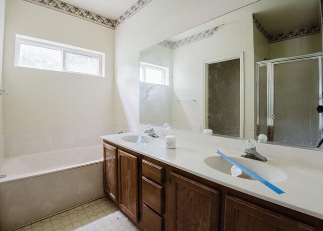 7 Cornwell St, Poughquag, NY 12570 - bathroom featuring a garden tub, double vanity, tile patterned floors, and a shower stall