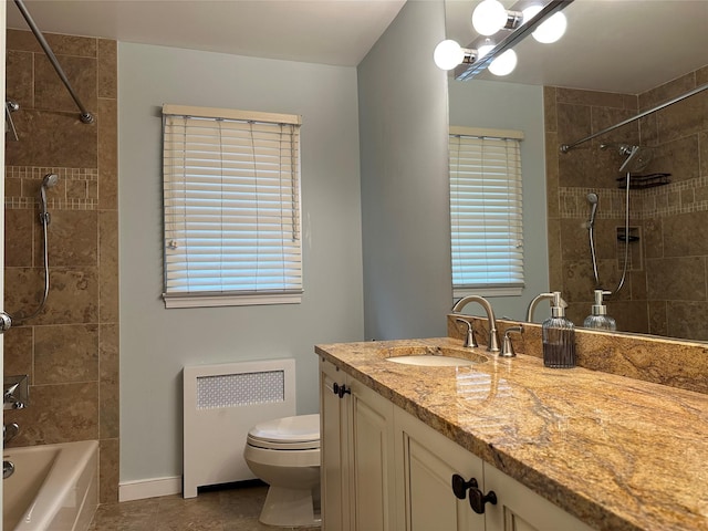 bathroom featuring radiator heating unit, tile patterned floors, shower / washtub combination, toilet, and vanity
