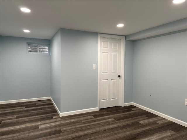 finished basement featuring recessed lighting, baseboards, and dark wood-style flooring