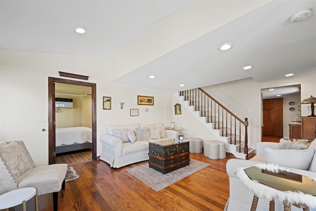 living area featuring recessed lighting, stairway, and wood finished floors