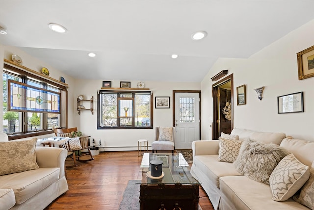 living area featuring baseboard heating, recessed lighting, wood finished floors, and vaulted ceiling